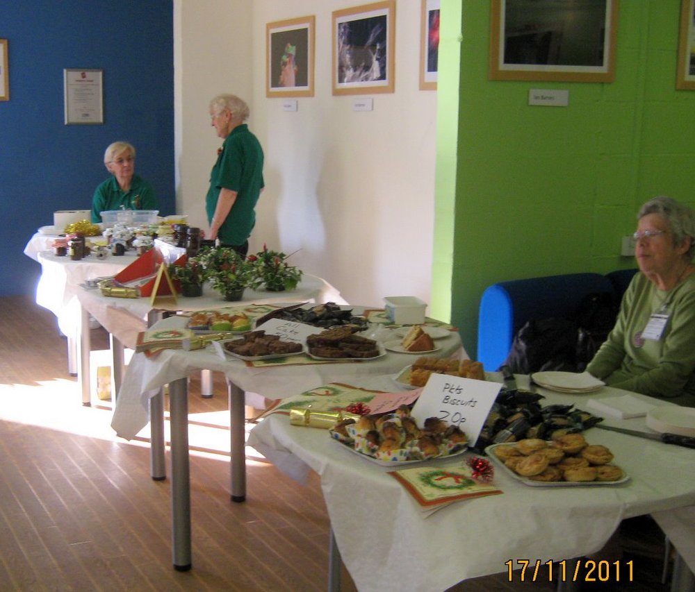 Joyce, Muriel and Mary manning raffle and jams,pickles and cakes stall